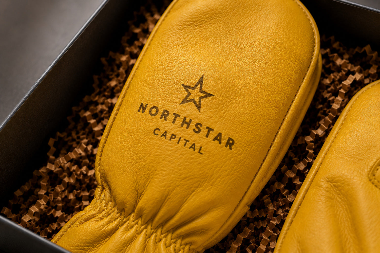 Hand Armor Gloves custom laser engraved leather gloves displayed in premium gift box with branded deerskin mittens.
